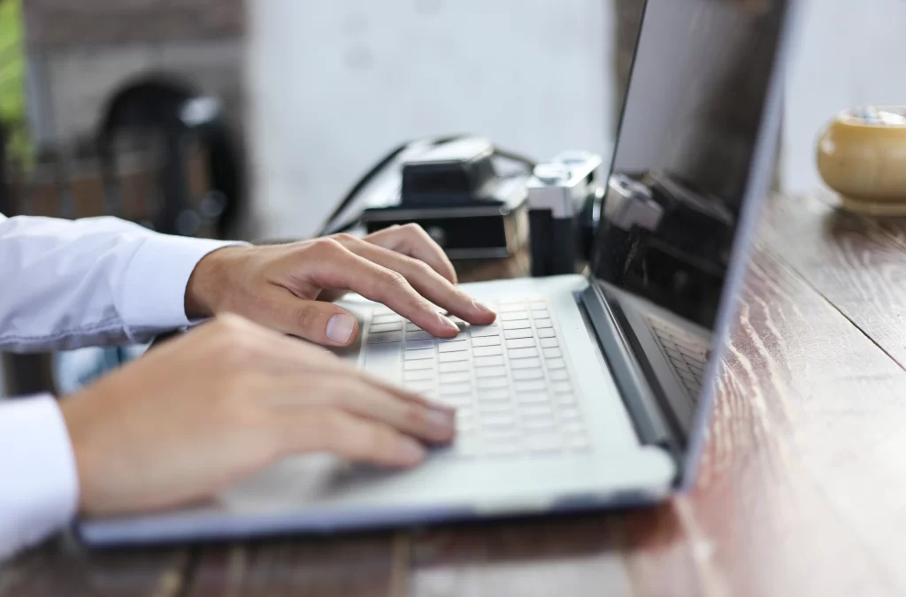 Person searching for information on laptop.