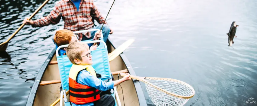 BML-A family of three fishing on a lake