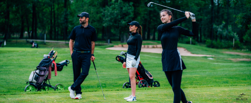 BML-Two Women and One Man Playing Golf