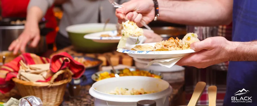 BML - Two people sharing a potluck dinner with one of them having a serving of food