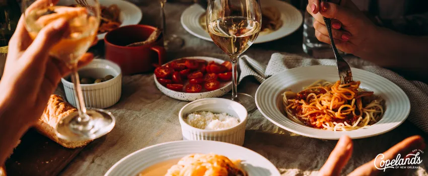 COJ - Group of people drinking wine and eating pasta