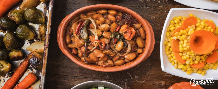 COJ - Various Thanksgiving side dishes on a wooden dining table