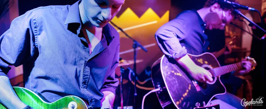 JDC - Two Men Playing Their Guitars